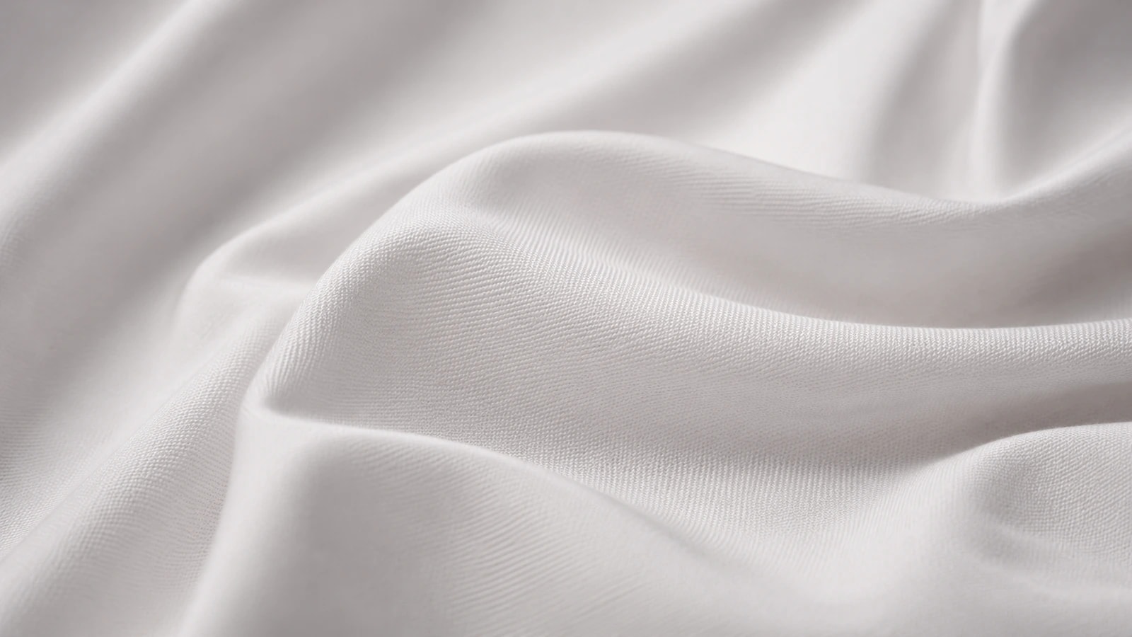 An ivory GX performance knit draped in soft folds