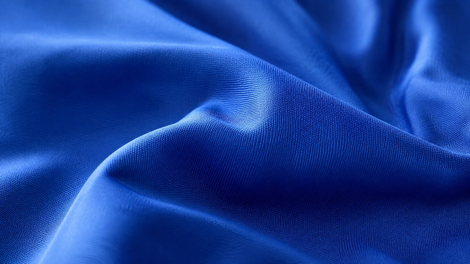 A deep blue GX performance knit draped in soft folds