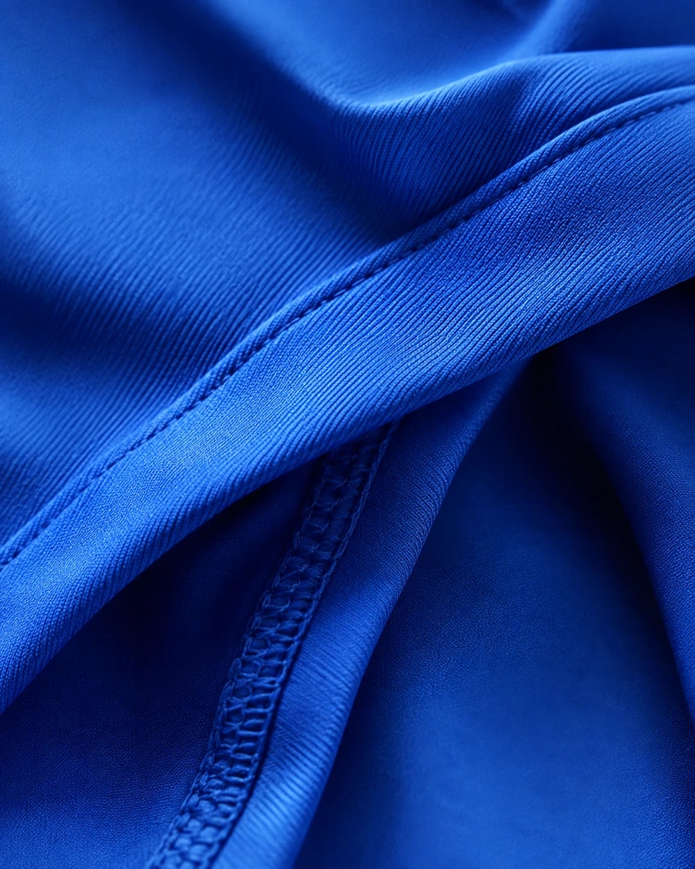 Macro close-up of a flatlock seam on a GX garment
